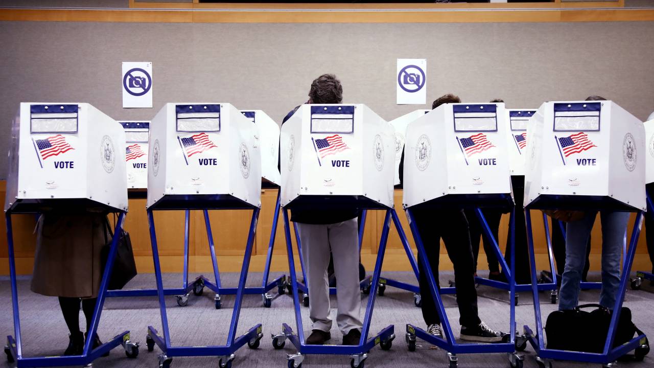 Voters fill out their ballots at a polling station in New York City on Election Day, November 5, 2024. (Photo by Leonardo Munoz / AFP)