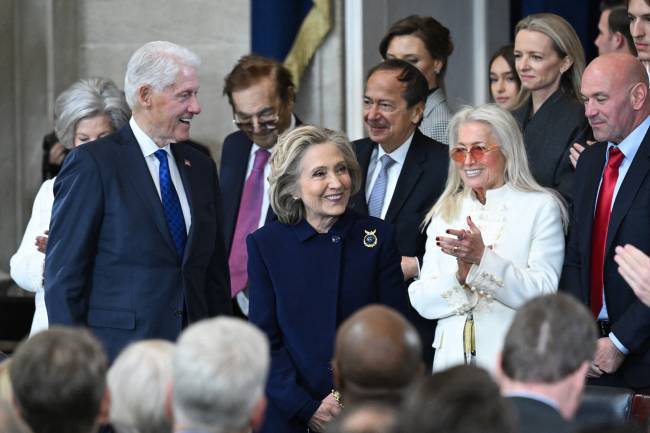 Former US President Bill Clinton and former Secretary of State Hillary Clinton arrive for the inauguration ceremony before Donald Trump is sworn in as the 47th US President in the US Capitol Rotunda in Washington, DC, on January 20, 2025. (Photo by SAUL LOEB / POOL / AFP)