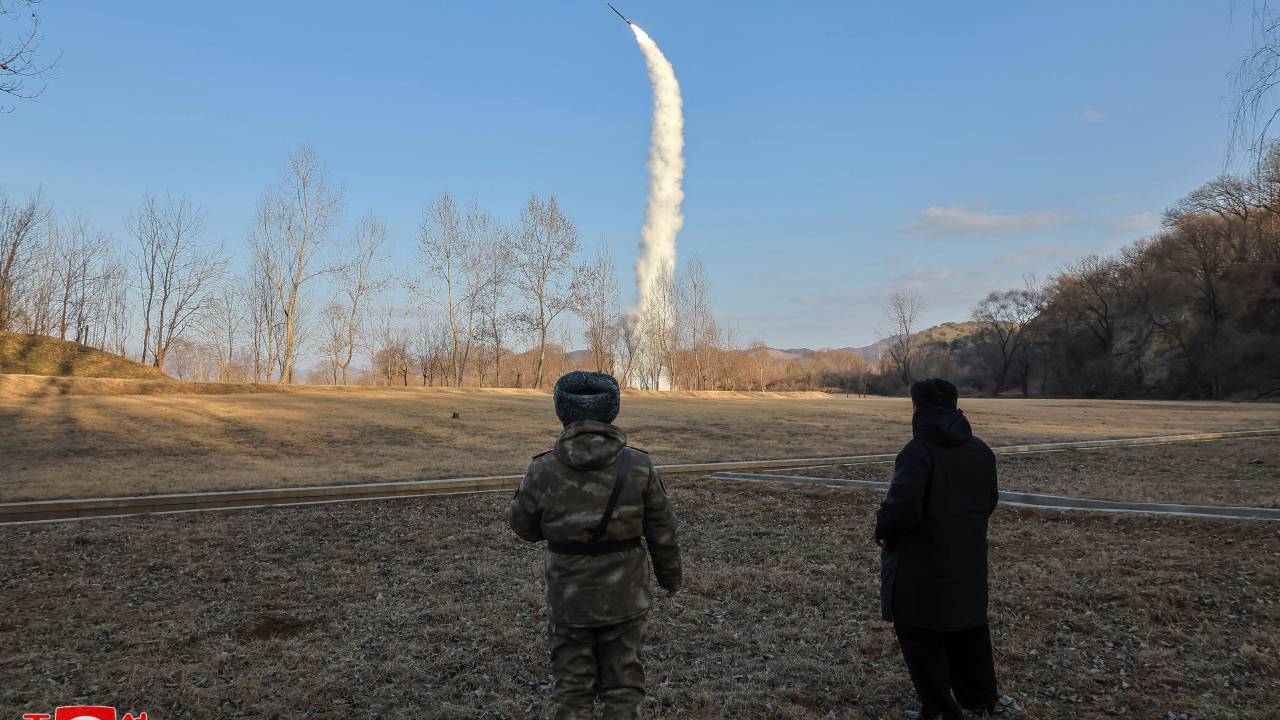 This picture taken on January 25, 2025 and released from North Korea's official Korean Central News Agency (KCNA) via KNS on January 26, 2025 shows North Korea's leader Kim Jong Un (R) overseeing the test-firing of a strategic cruise and guided weapon at sea (underwater), at an undisclosed location in North Korea. North Korea has test-fired sea-to-surface strategic guided cruise missiles, the country's state news agency reported on January 26, adding that the weapons