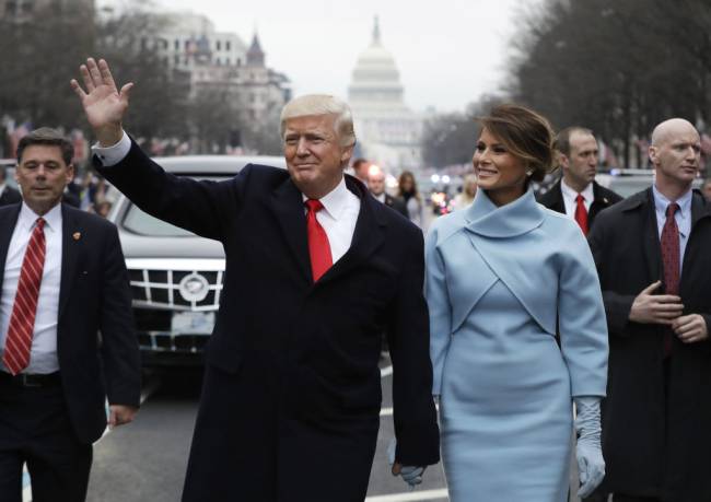 FILE: U.S. President Donald Trump waves while walking with U.S. First Lady Melania Trump, during a parade following the 58th presidential inauguration in Washington, D.C., U.S., on Friday, Jan. 20, 2017. President Donald Trump says he wont attend President-elect Joe Bidens inauguration next week after Trump supporters mounted a violent assault on the U.S. the capitol. Trumps decision to skip the ceremony is a notable break from recent precedent as we look back on Trumps own inauguration 4 years ago on the 20th Jan, 2017. Photographer: Evan Vucci/Pool via Bloomberg