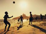 People playing football at Ipanema Beach in Rio