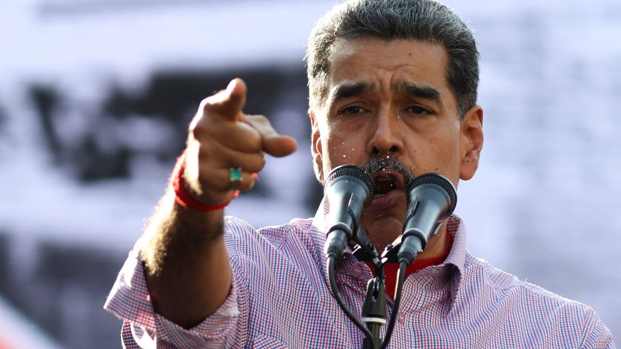 Venezuelan President Nicolas Maduro speaks to supporters during a rally to commemorate 36 years of the Patriotic Rebellion of 1989 in Caracas, on February 27, 2025. (Photo by Pedro MATTEY / AFP)