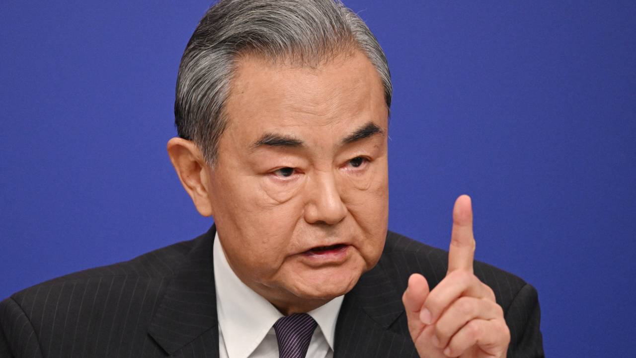 China's Foreign Minister Wang Yi speaks at a press conference during the ongoing National People's Congress (NPC) in Beijing on March 7, 2025. (Photo by GREG BAKER / AFP)