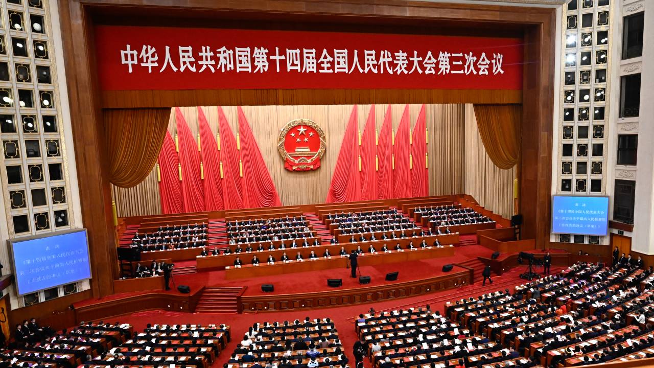 A general view as delegates attend the closing session of the National People's Congress (NPC) at the Great Hall of the People in Beijing on March 11, 2025. (Photo by Pedro PARDO / AFP)