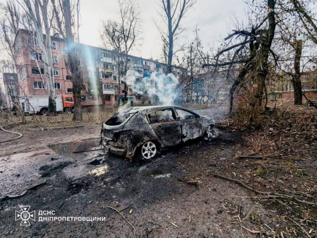 KRYVYI RIH, UKRAINE - MARCH 12: (----EDITORIAL USE ONLY - MANDATORY CREDIT - 'STATE EMERGENCY SERVICE OF UKRAINE / HANDOUT' - NO MARKETING NO ADVERTISING CAMPAIGNS - DISTRIBUTED AS A SERVICE TO CLIENTS---- ) Smoke rises from a damaged car after Russian troops launched a missile strike, damaging an infrastructure facility and increasing the number of victims to 9 on Kryvyi Rih, Ukraine on March 12, 2025. During efforts to eliminate the consequences of the attack, Russia struck again, damaging 2 rescue vehicles. The attack caused a fire in 3 garages and 4 cars, covering an area of 100 sq.m. Additionally, multi-storey residential buildings, administrative buildings, a shop, and 12 cars were also damaged. (Photo by State Emergency Service of Ukraine/Anadolu via Getty Images)