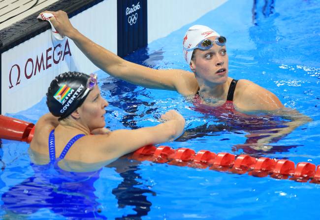 Swimming – Olympics: Day 6 RIO DE JANEIRO, BRAZIL - AUGUST 11: Hilary Caldwell of Canada and Kirsty Coventry of Zimbabwe look up to the scoreboard following their Heat in the Women's 200m Backstroke on Day 6 of the Rio 2016 Olympic Games at the Olympic Aquatics Stadium on August 11, 2016 in Rio de Janerio, Brazil.