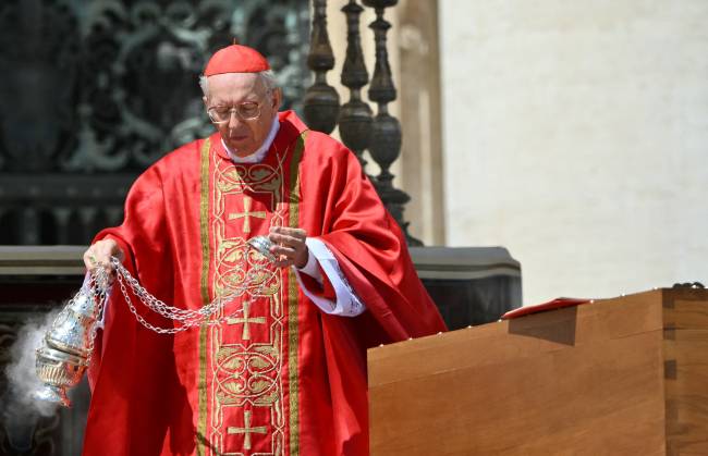 Italian cardinal Giovanni Battista Re blesses the coffin of late Pope Francis, during the funeral ceremony at St Peter's Square at the Vatican on April 26, 2025. (Photo by Alberto PIZZOLI / AFP)