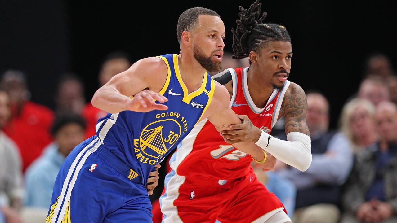 MEMPHIS, TENNESSEE - APRIL 01: Ja Morant #12 of the Memphis Grizzlies guards Stephen Curry #30 of the Golden State Warriors during the first half at FedExForum on April 01, 2025 in Memphis, Tennessee. NOTE TO USER: User expressly acknowledges and agrees that, by downloading and or using this photograph, User is consenting to the terms and conditions of the Getty Images License Agreement. (Photo by Justin Ford/Getty Images)