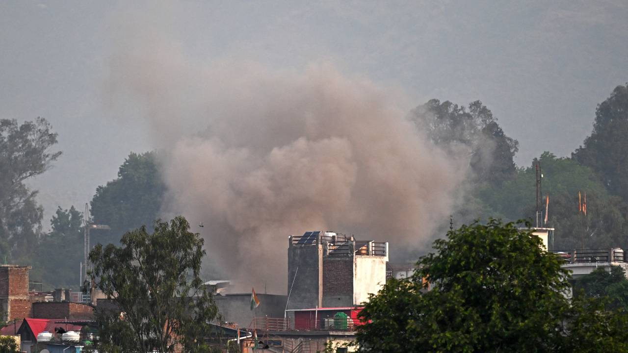 Smoke billows after an artillery shell landed in the main town of Poonch district in India's Jammu region on May 7, 2025. At least eight Indians were killed and 29 others wounded Wednesday in the town of Poonch in Kashmir, close to the de facto border with Pakistan, a local Indian government official said. (Photo by Punit PARANJPE / AFP)