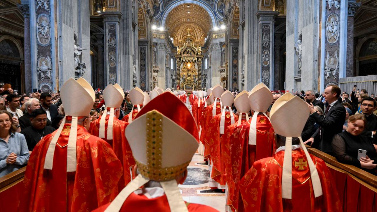 This photo taken and handout on May 7, 2025 by The Vatican Media shows cardinals during a holy mass for the Election of the Roman Pontiff, prior to the start of the conclave, at St Peter's Basilica in The Vatican. (Photo by Francesco Sforza / VATICAN MEDIA / AFP) / RESTRICTED TO EDITORIAL USE - MANDATORY CREDIT "AFP PHOTO / VATICAN MEDIA" - NO MARKETING - NO ADVERTISING CAMPAIGNS - DISTRIBUTED AS A SERVICE TO CLIENTS