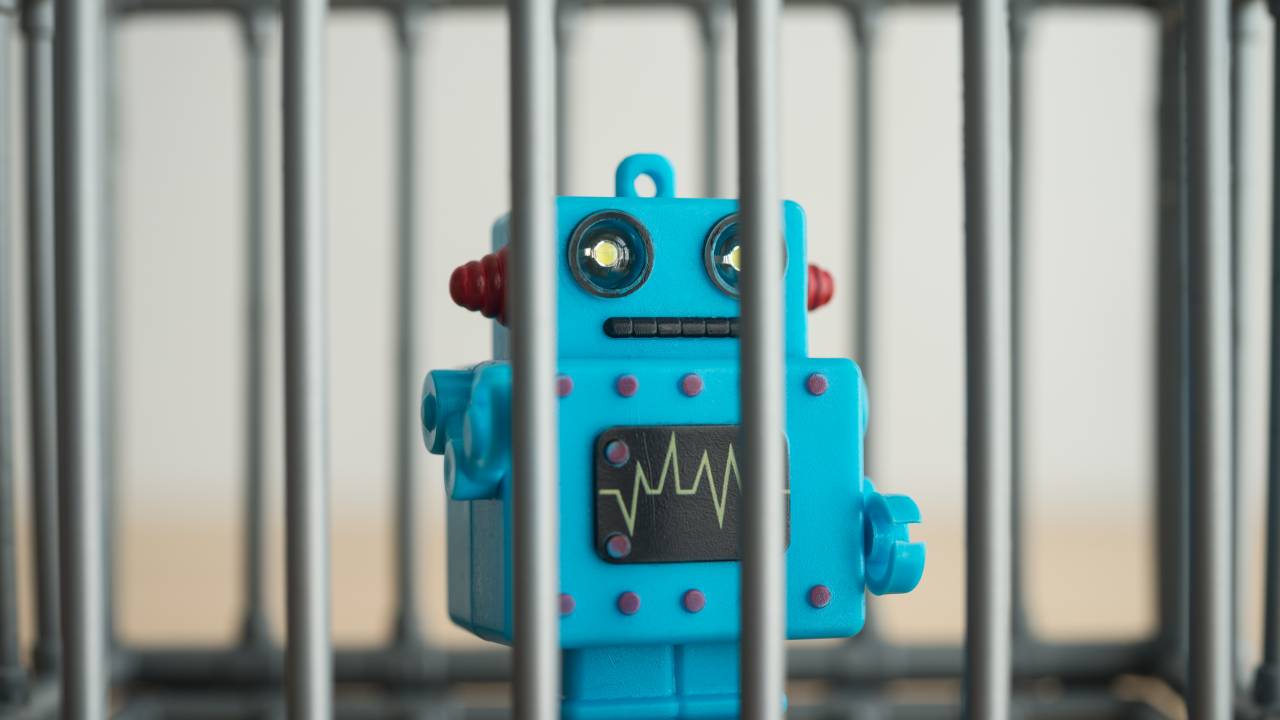 Robô inteligência artificial preso aparece atrás de grades