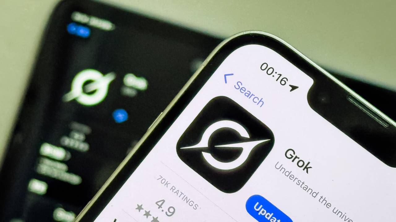 CHONGQING, CHINA - FEBRUARY 24: In this photo illustration, a smartphone screen displays the updated Grok AI app page on the App Store, showing its newly changed logo, while another device in the background also features the new icon, on February 24, 2025 in Chongqing, China. Grok, developed by xAI, is an artificial intelligence chatbot integrated into X (formerly Twitter) and has recently undergone a visual rebranding with a new app icon.