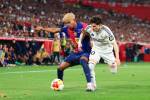SEVILLE, SPAIN - APRIL 26: Lamine Yamal of FC Barcelona competes for the ball with Fran Garcia of Real Madrid during the Copa del Rey Final match between FC Barcelona and Real Madrid at Estadio de La Cartuja on April 26, 2025 in Seville, Spain. (Photo by Fran Santiago/Getty Images)
