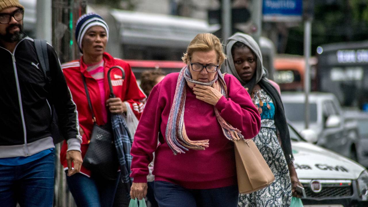 Warmly dressed pedestrians face the cold on Paulista Avenue in Sao Paulo, Brazil, on June 30, 2023. (Photo by Cris Faga/NurPhoto via Getty Images)