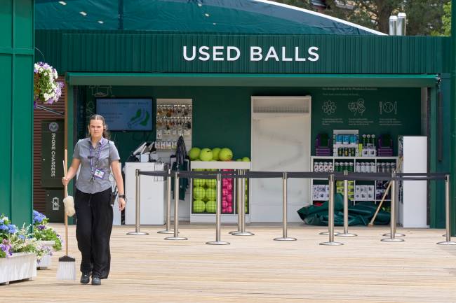 Previews: The Championships – Wimbledon 2025 LONDON, ENGLAND - JUNE 26: A cleaning worker walks past the used balls store before The Championships - Wimbledon 2025 at All England Lawn Tennis and Croquet Club on June 26, 2025 in London, England. (Photo by Peter van den Berg/ISI Photos/ISI Photos via Getty Images)