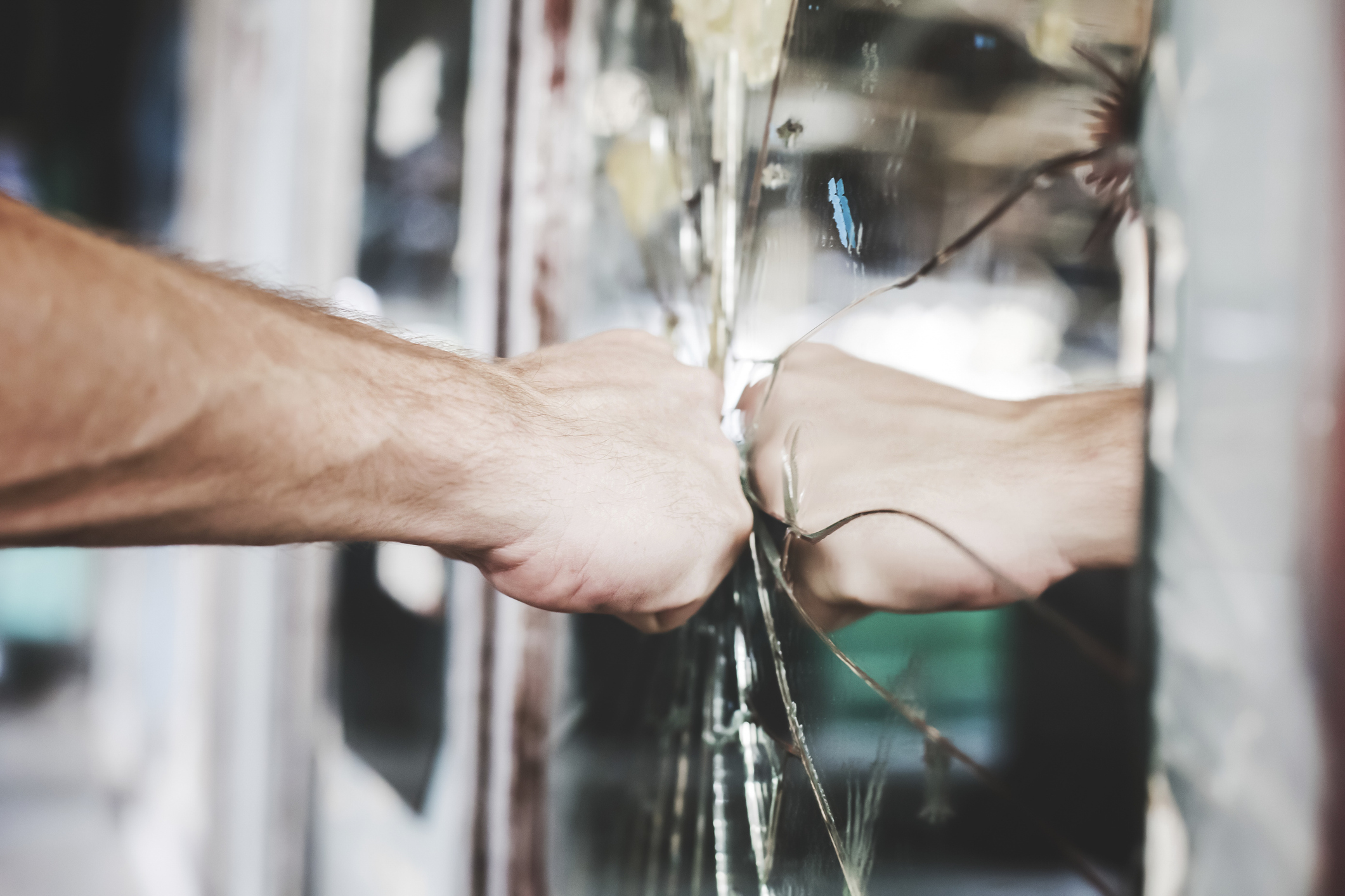 Aggravated man punches a mirror