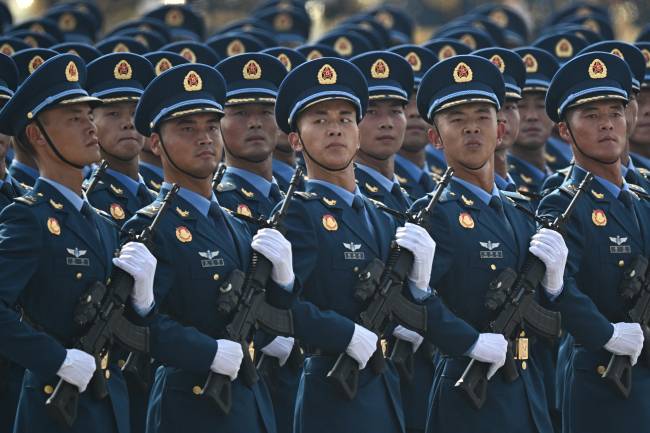 Chinese troops march during a military parade marking the 80th anniversary of victory over Japan and the end of World War II, in Beijing’s Tiananmen Square on September 3, 2025. (Photo by Pedro PARDO / AFP)