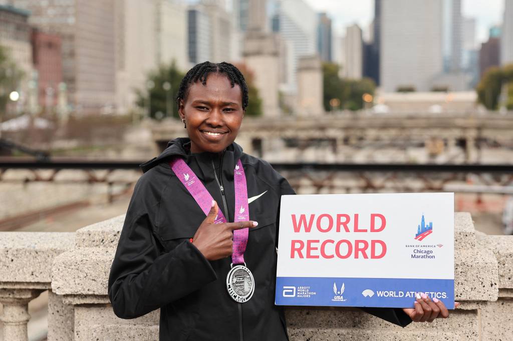 (FILES) Ruth Chepngetich of Kenya poses for a portrait after winning the 2024 Chicago Marathon professional women's division and setting a new world record with a time of 2:09:56 at Grant Park in Chicago, Illinois on October 13, 2024. Kenya's marathon world record holder, Ruth Chepngetich has been banned for three years for doping, the Athletics Integrity Unit (AIU) announced on October 23, 2025. The 31-year-old, a former world marathon champion and a three-time winner of the Chicago Marathon, tested positive for the banned diuretic hydrochlorothiazide in March. She had been provisionally banned from July. (Photo by Michael Reaves / GETTY IMAGES NORTH AMERICA / AFP)