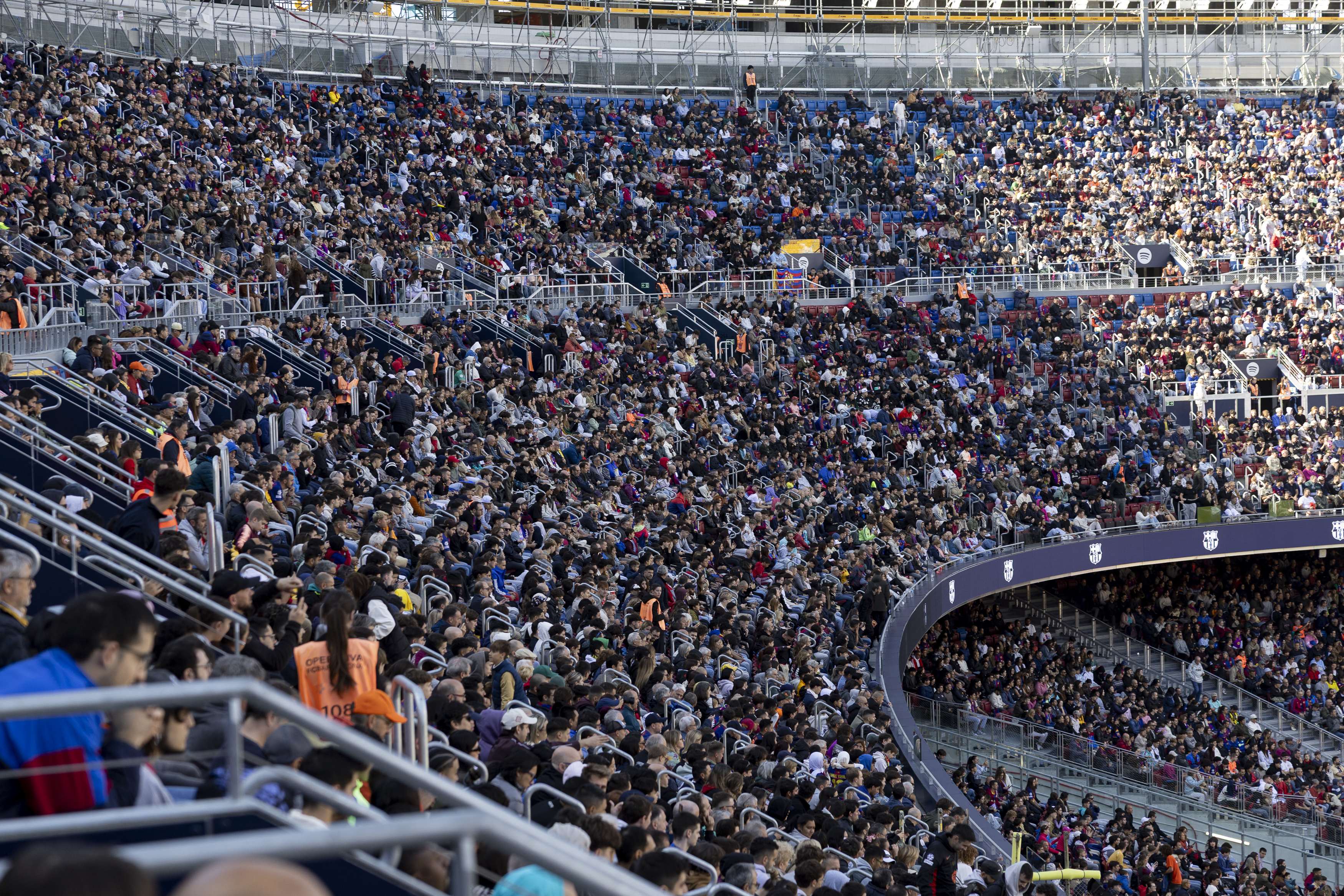 Barcelona supporters attend the first FC Barcelona open training session at the new Camp Nou on November 7, 2025 in Barcelona. 23,000 fans attended a sold-out open door FC Barcelona training session at the new Camp Nou today, as the stadium reopens following it's closure for refurbishment on May 28, 2023. (Photo by Josep LAGO / AFP)