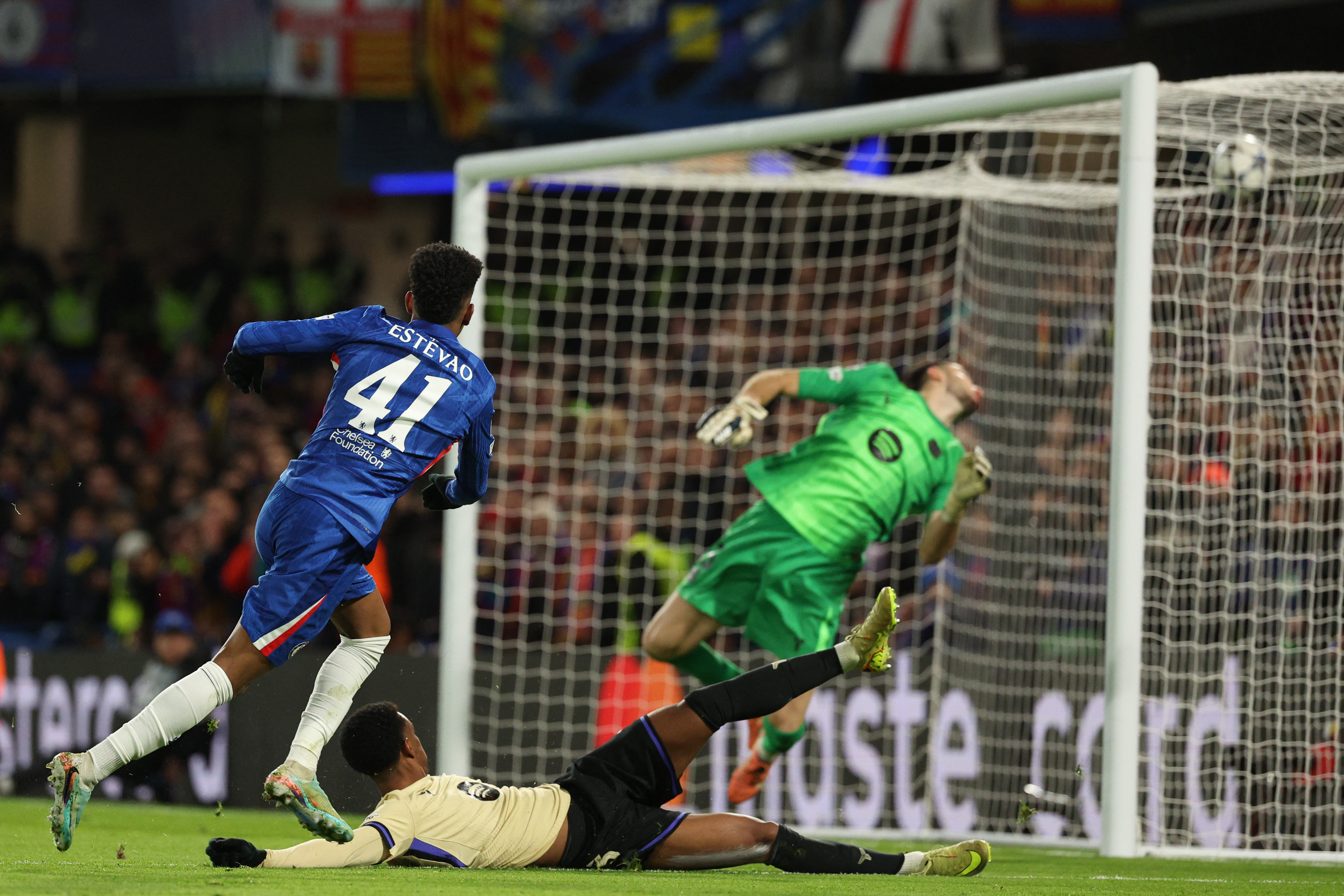 Chelsea's Brazilian midfielder #41 Estevao scores their second goal during the UEFA Champions League league-phase football match between Chelsea and Barcelona at Stamford Bridge in London on November 25, 2025. (Photo by Adrian Dennis / AFP)
