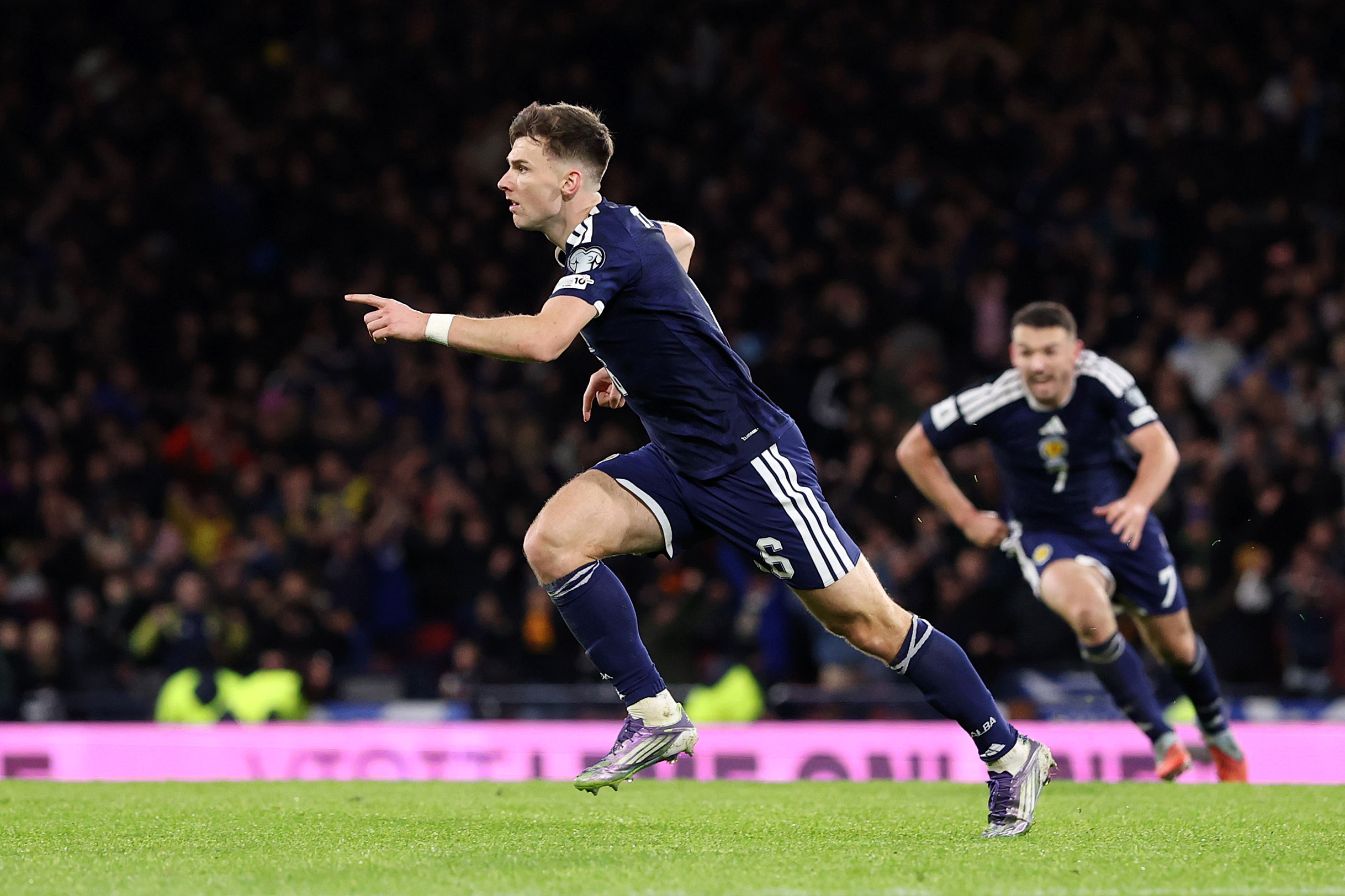 GLASGOW, SCOTLAND - NOVEMBER 18: Kieran Tierney of Scotland celebrates scoring his team's third goal during the FIFA World Cup 2026 qualifier match between Scotland and Denmark at Hampden Park on November 18, 2025 in Glasgow, Scotland. (Photo by Stu Forster/Getty Images)