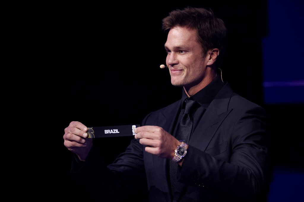WASHINGTON, DC - DECEMBER 05: Draw assistant Tom Brady draws out the card of Brazil during the FIFA World Cup 2026 Official Draw at John F. Kennedy Center for the Performing Arts on December 05, 2025 in Washington, DC. Patrick Smith/Getty Images/AFP (Photo by Patrick Smith / GETTY IMAGES NORTH AMERICA / Getty Images via AFP)