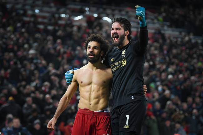 Liverpool FC v Manchester United – Premier League LIVERPOOL, ENGLAND - JANUARY 19: Mohamed Salah of Liverpool celebrates his goal to make it 2-0 with Alisson Becker during the Premier League match between Liverpool FC and Manchester United at Anfield on January 19, 2020 in Liverpool, United Kingdom. (Photo by Michael Regan/Getty Images)