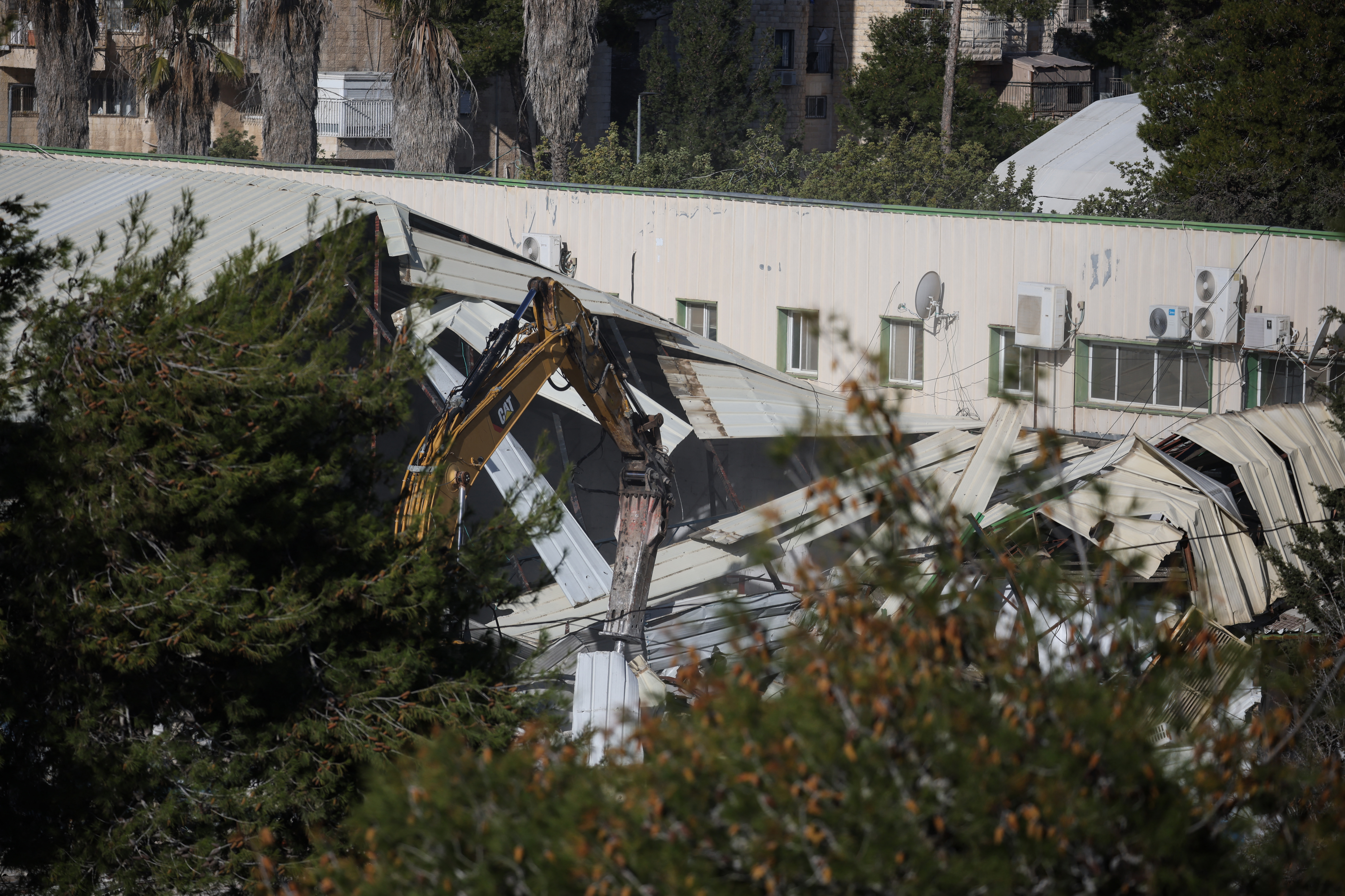 A photograph shows a demolished structure inside the headquarters of the United Nations Relief and Works Agency (UNRWA) in the Sheikh Jarrah neighbourhood of Israeli-annexed east Jerusalem on January 20, 2026. The chief of the UN's agency for Palestinian refugees denounced the Israeli authorities' seizure of assets from its east Jerusalem compound earlier this month, which police told AFP was part of a debt-collection operation. The compound in Israeli-annexed east Jerusalem has been empty of UNRWA staff since January, when the law banning its operations took effect after a months-long battle over its work in the Gaza Strip. Israel had accused UNRWA of providing cover for Hamas militants, and the legislation also forbids contact between the agency and Israeli officials. (Photo by ilia yefimovich / AFP)