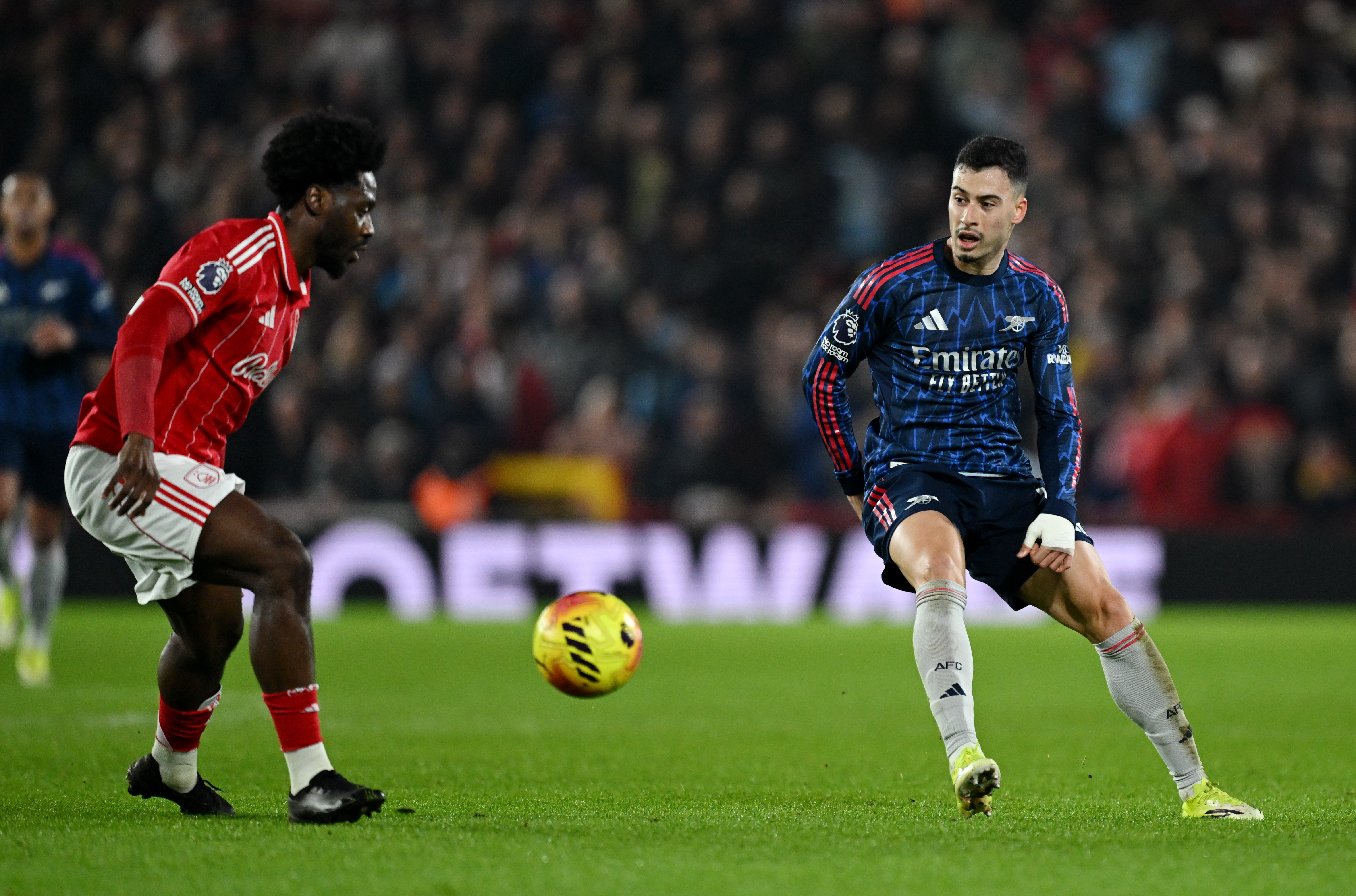 NOTTINGHAM, ENGLAND - JANUARY 17: Gabriel Martinelli of Arsenal is put under pressure by Ola Aina of Nottingham Forest during the Premier League match between Nottingham Forest and Arsenal at City Ground on January 17, 2026 in Nottingham, England. (Photo by David Price/Arsenal FC via Getty Images)