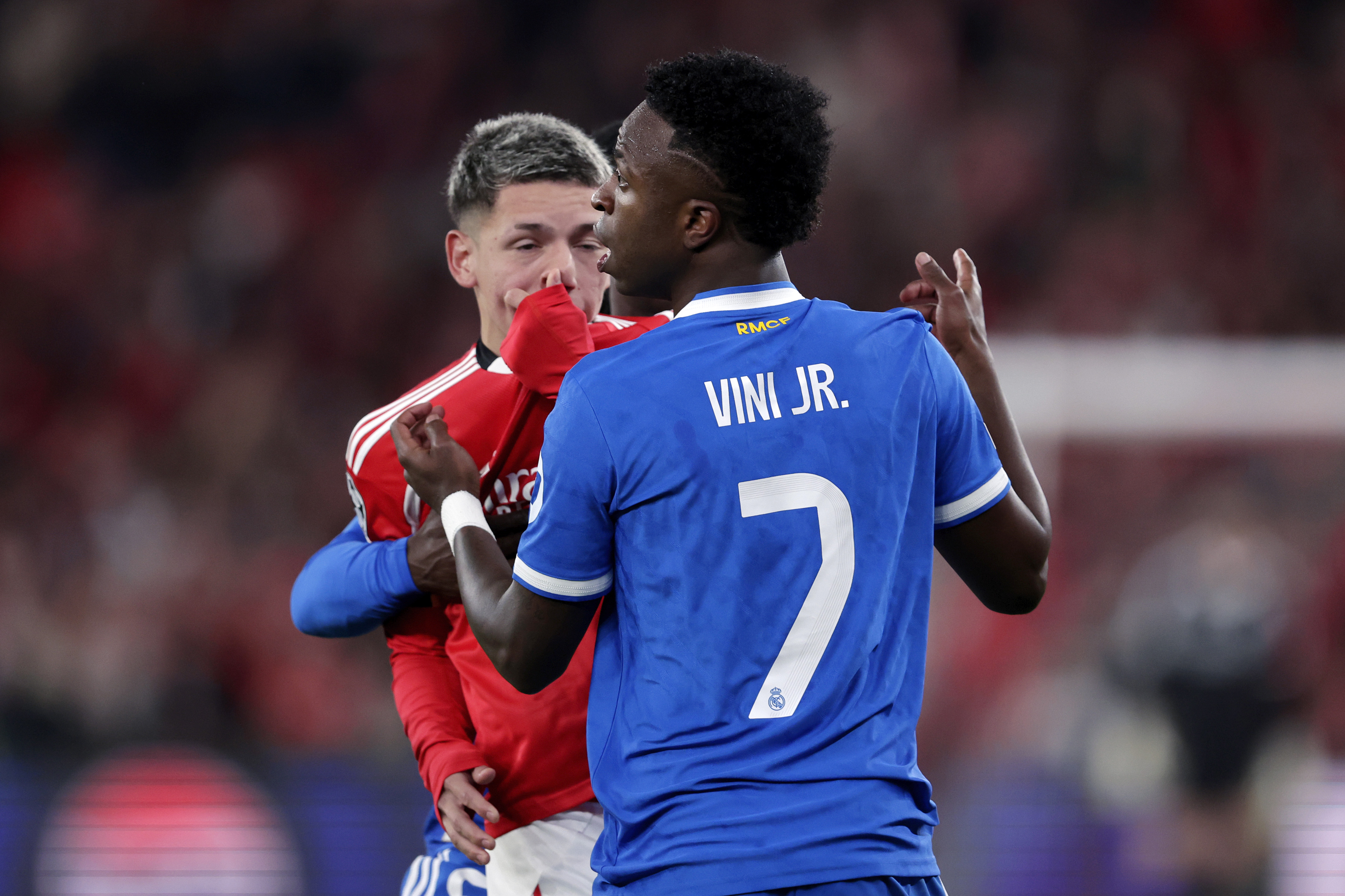 LISBON, PORTUGAL - FEBRUARY 17: Vinicius Junior of Real Madrid in a clash with Gianluca Prestianni of Benfica during the UEFA Champions League match between Benfica v Real Madrid at the Estadio Da Luz on February 17, 2026 in Lisbon Portugal (Photo by Eric Verhoeven/Soccrates/Getty Images)