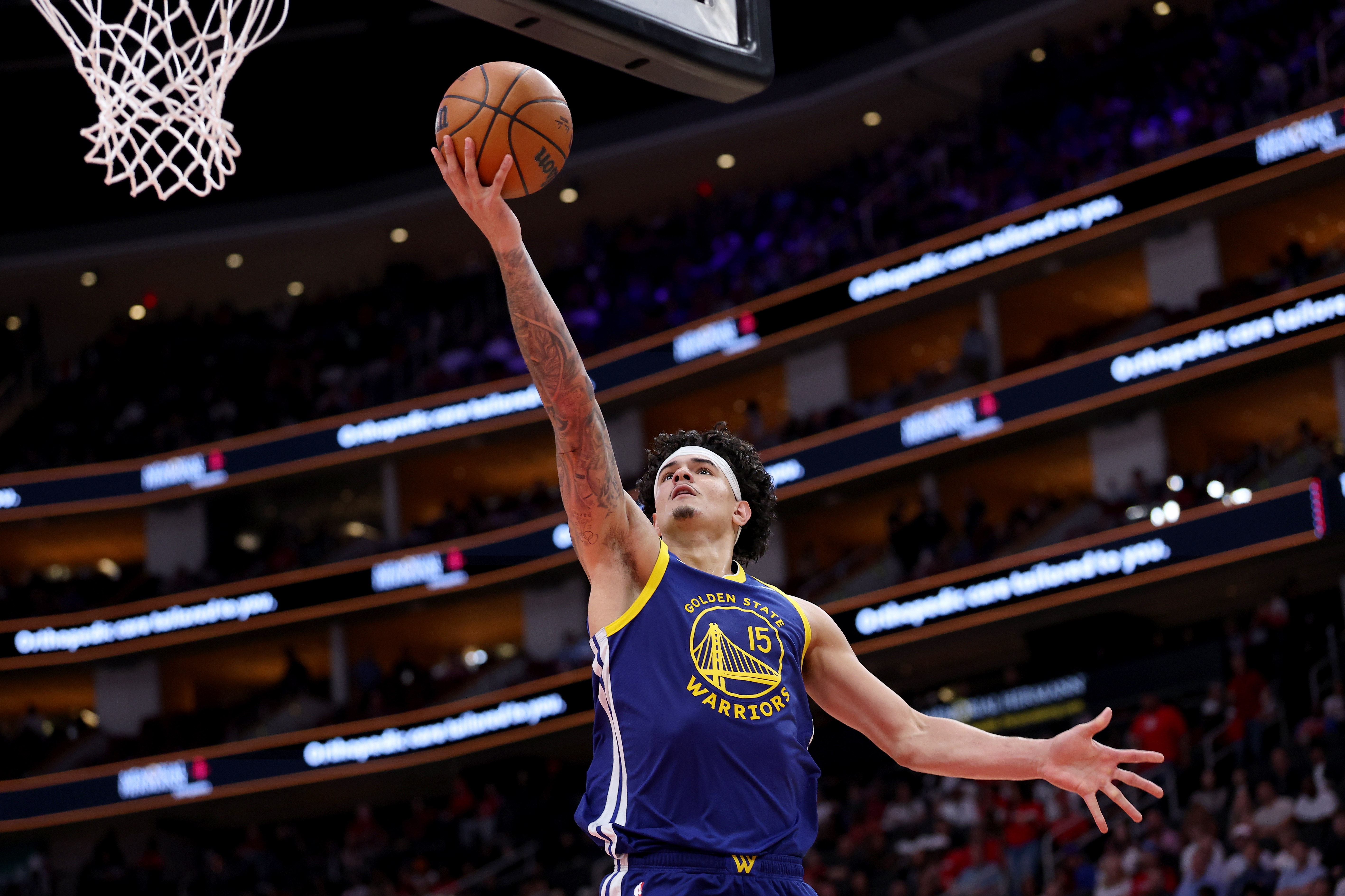 HOUSTON, TEXAS - MARCH 05: Gui Santos #15 of the Golden State Warriors shoots a layup in the second half against the Houston Rockets at Toyota Center on March 05, 2026 in Houston, Texas. NOTE TO USER: User expressly acknowledges and agrees that, by downloading and or using this photograph, User is consenting to the terms and conditions of the Getty Images License Agreement. (Photo by Tim Warner/Getty Images)