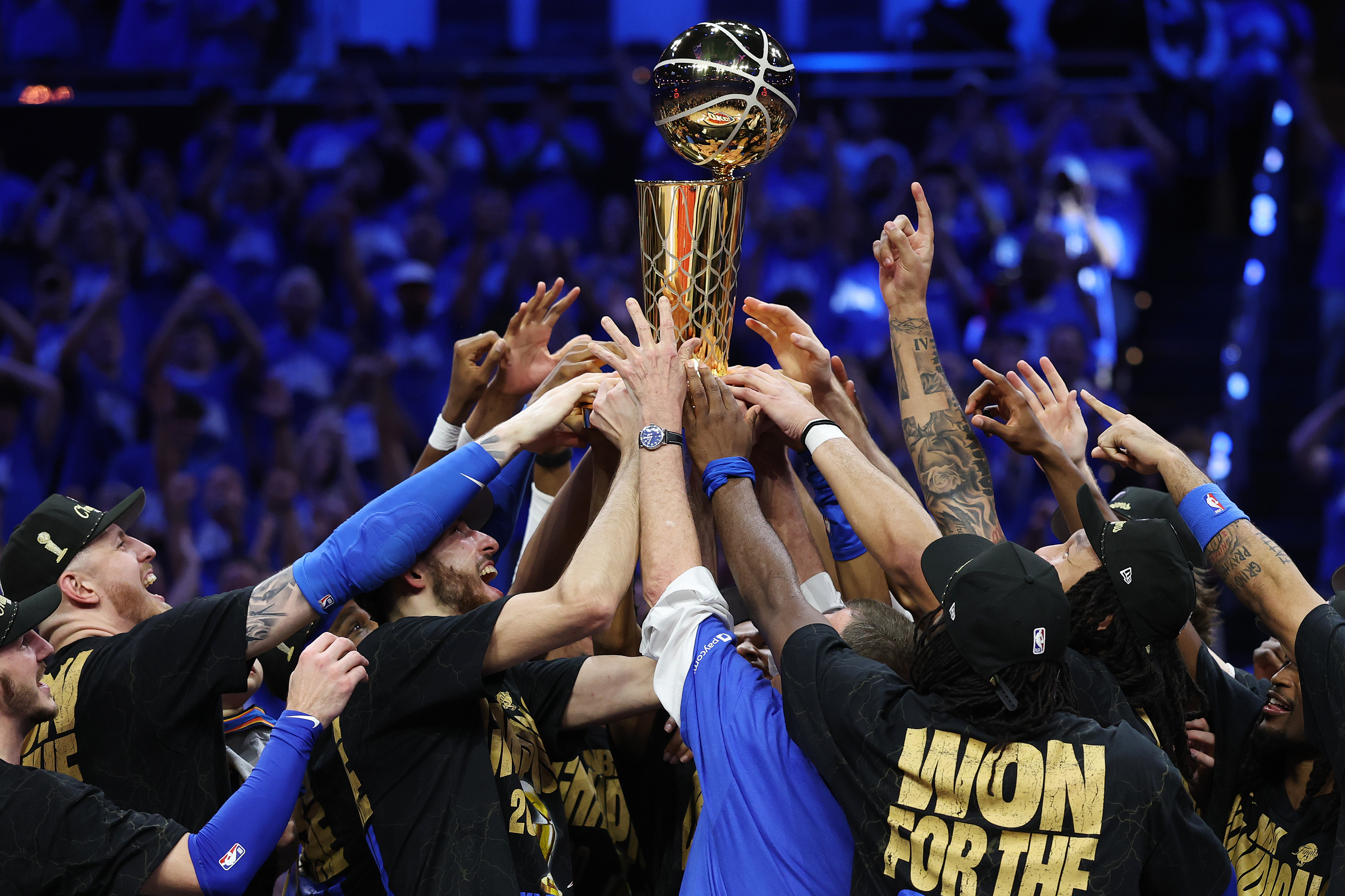 OKLAHOMA CITY, OKLAHOMA - JUNE 22: The Oklahoma City Thunder celebrate with the Larry O'Brien Championship Trophy after defeating the Indiana Pacers 103-91 in Game Seven of the 2025 NBA Finals at Paycom Center on June 22, 2025 in Oklahoma City, Oklahoma. NOTE TO USER: User expressly acknowledges and agrees that, by downloading and or using this photograph, User is consenting to the terms and conditions of the Getty Images License Agreement. (Photo by Matthew Stockman/Getty Images)