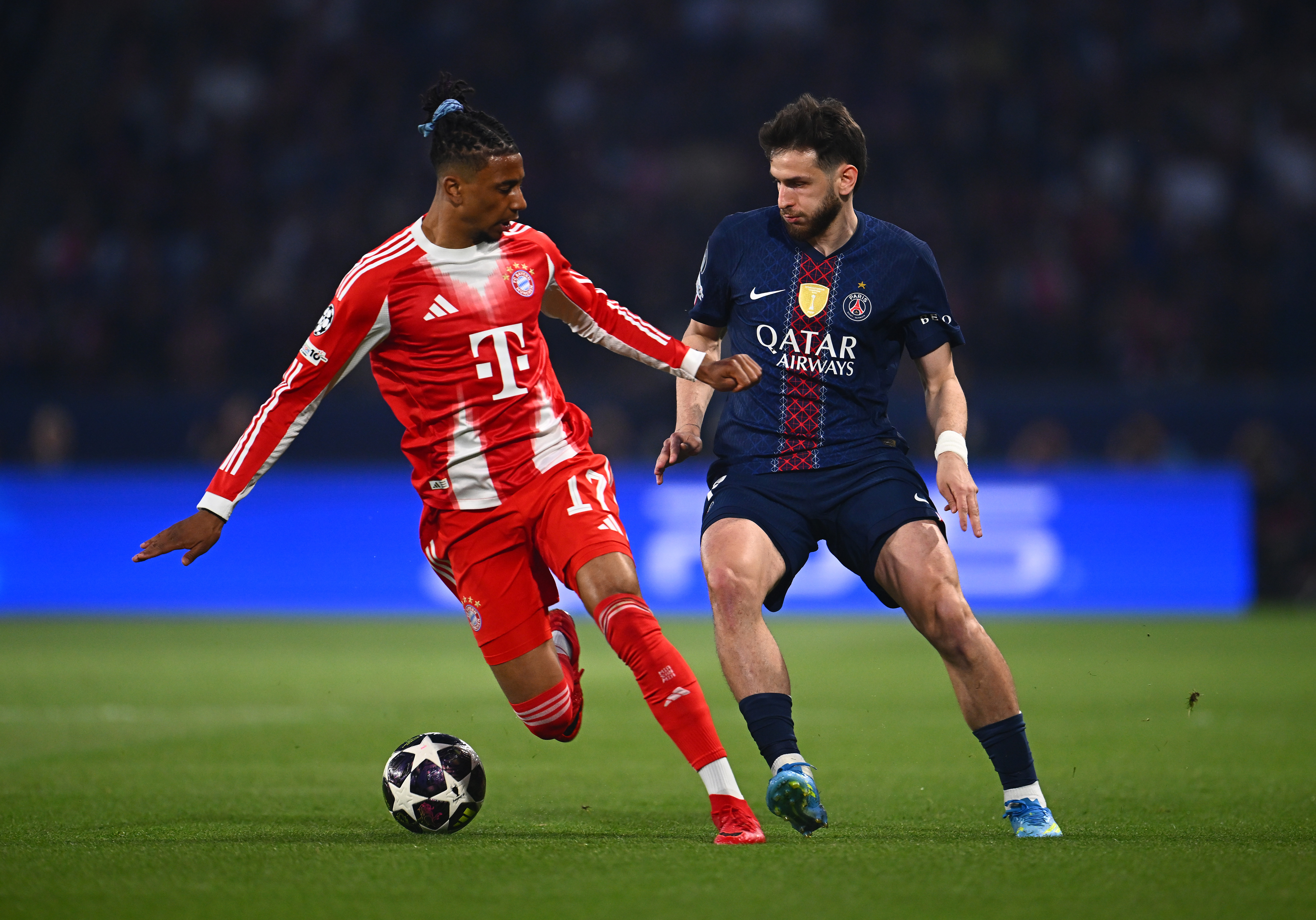 PARIS, FRANCE - APRIL 28: Michael Olise of FC Bayern Munich and Khvicha Kvaratskhelia of Paris Saint-Germain compete for the ball during the UEFA Champions League 2025/26 Semi Final First Leg match between Paris Saint-Germain and FC Bayern München at Parc des Princes on April 28, 2026 in Paris, France. (Photo by Mattia Ozbot - UEFA/UEFA via Getty Images)