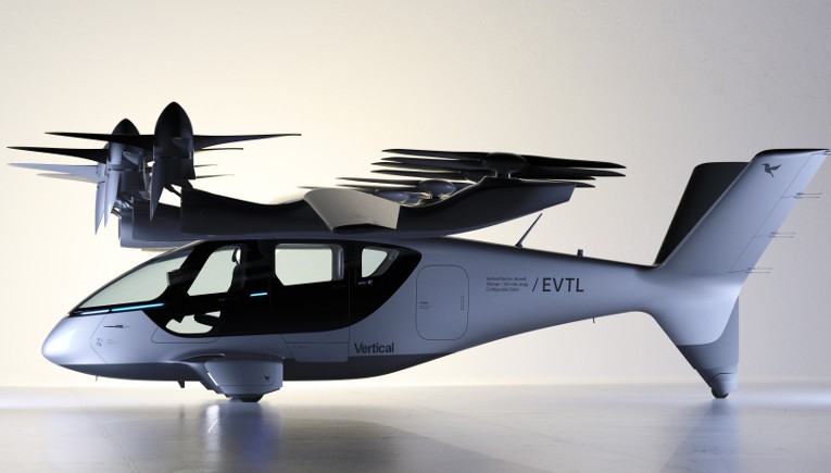 Aeronave elétrica de decolagem e pouso vertical (eVTOL) cinza-claro, com quatro conjuntos de hélices pretas sobre as asas, em um estúdio branco. O nome Vertical e a sigla /EVTL estão escritos na fuselagem