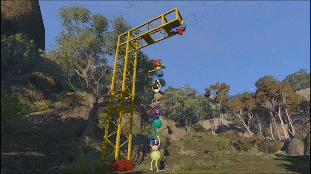 Uma torre amarela alta com uma plataforma superior, de onde um personagem azul e vermelho se pendura. Abaixo, uma fila de oito personagens coloridos, um sobre o outro, tentando alcançar o topo. O cenário é uma paisagem montanhosa com árvores e céu azul