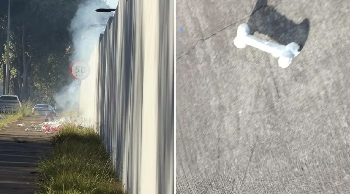 À esquerda, fumaça branca sobe de lixo queimando na beira de uma estrada, com carros ao fundo e uma placa de limite de velocidade 50 km/h. À direita, um skate branco com rodas pretas e um osso branco no centro, visto de cima, projetando uma sombra escura no asfalto cinza